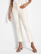 Cream high-waisted pants with a flat front and subtle crease, featuring a cropped demi-boot leg.