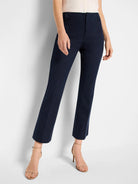 Dark navy demi-boot pants, cropped at the ankle. Features a flat front and visible belt loops.