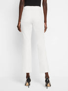 White demi boot pants, rear view. Features belt loops, two back patch pockets, and a cropped length.