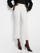 White cropped demi-boot pants, smooth bi-stretch fabric, flat front with pressed leg creases.
