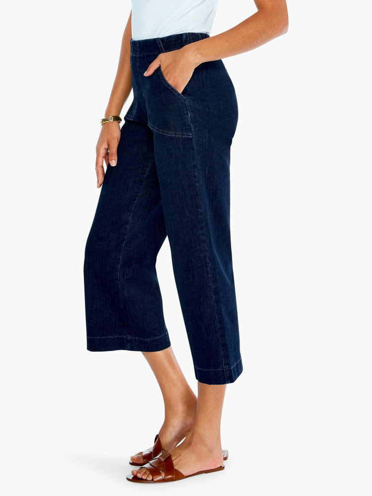 Dark wash denim wide-leg cropped jeans; straight hem, pockets.