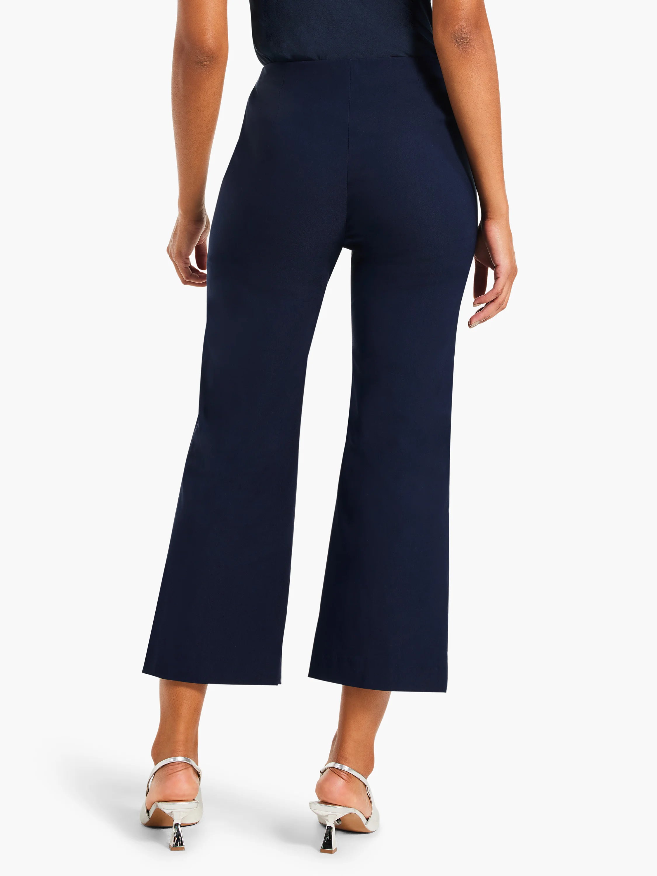 Dark blue wide-leg crop pants, shown from the back. Smooth, polished fabric with a wide leg cut, ending above the ankle.