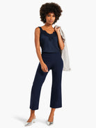 Dark navy wide-leg crop pants with a smooth finish, ending above the ankle.