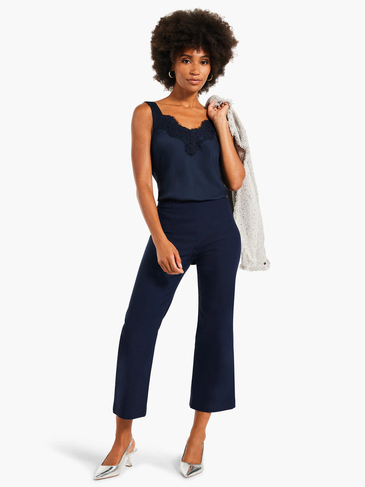Dark navy wide-leg crop pants with a smooth finish, ending above the ankle.