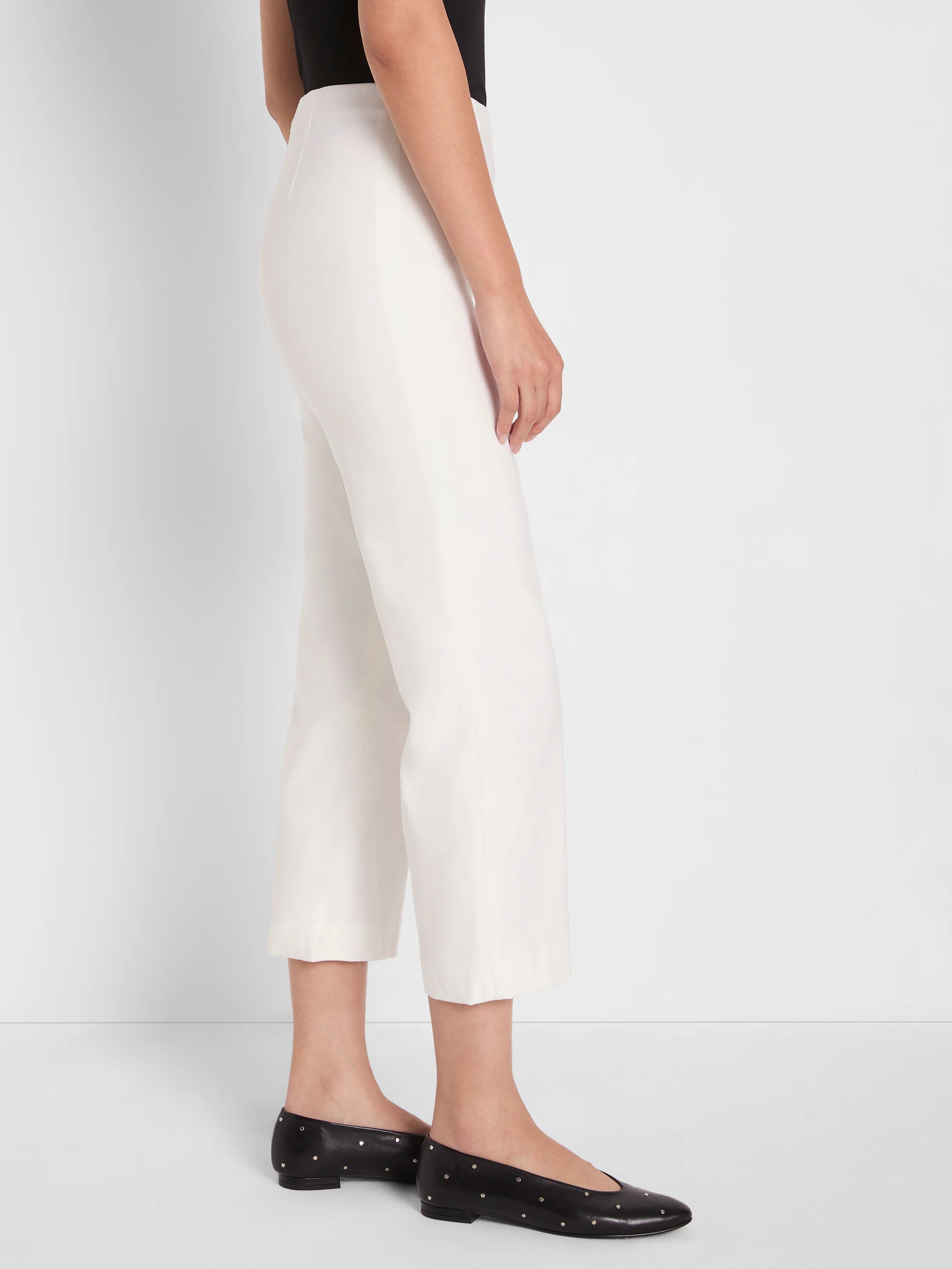 Off-white, wide-leg crop pants with a smooth drape, hitting above the ankle.