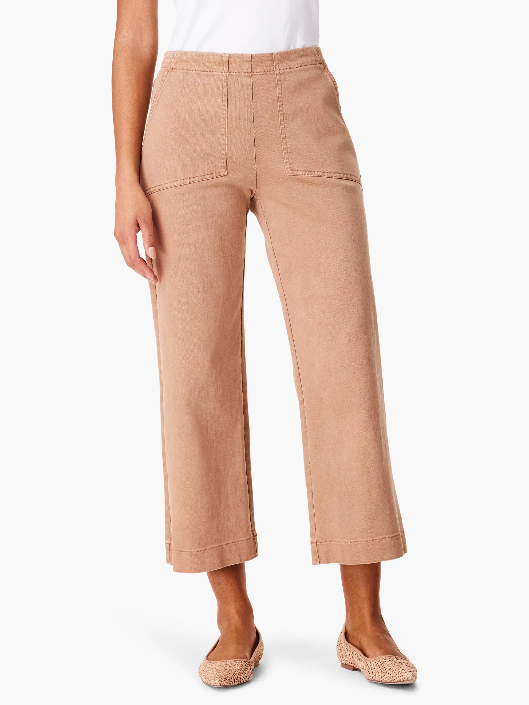 Tan wide-leg cropped jeans with front patch pockets and prominent stitching.