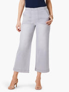 Light grey wide-leg cropped jeans with large front patch pockets and distinct vertical front seams.