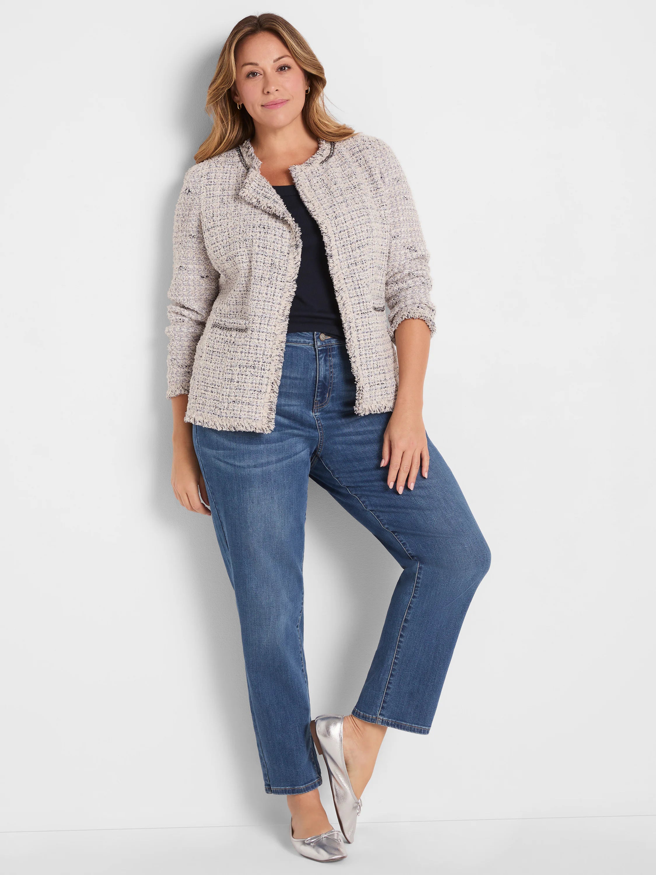 Medium blue wash mid-rise girlfriend jeans. Relaxed fit with a slightly tapered leg.