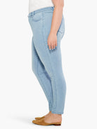 Pale blue, smooth-wash denim jeans. Slim fit, ankle length, side view.