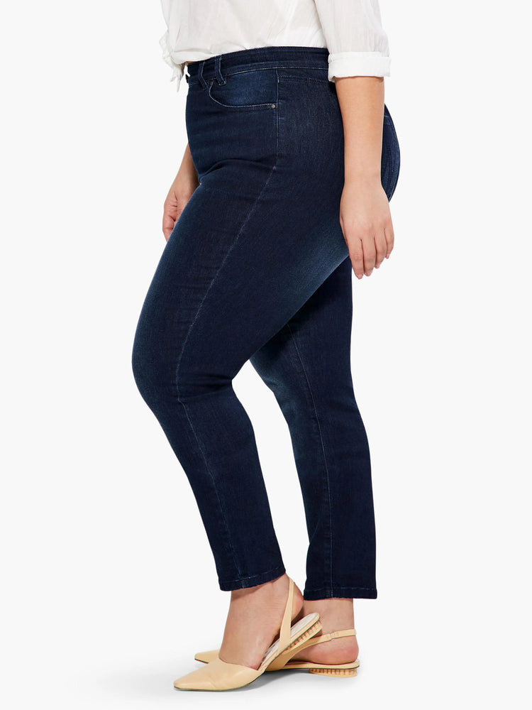 Dark indigo slim ankle jeans, featuring a deep wash and subtle fading on the thighs, with a tapered fit to the ankle.