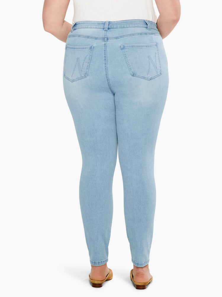 Light blue, mid-rise slim ankle jeans; back view shows two back pockets with stitching detail.