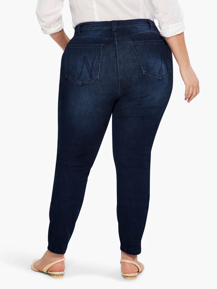 Dark wash denim jeans; slim, ankle length; mid-rise. Back view.