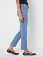 Light blue straight ankle jeans with a raw, frayed hem.