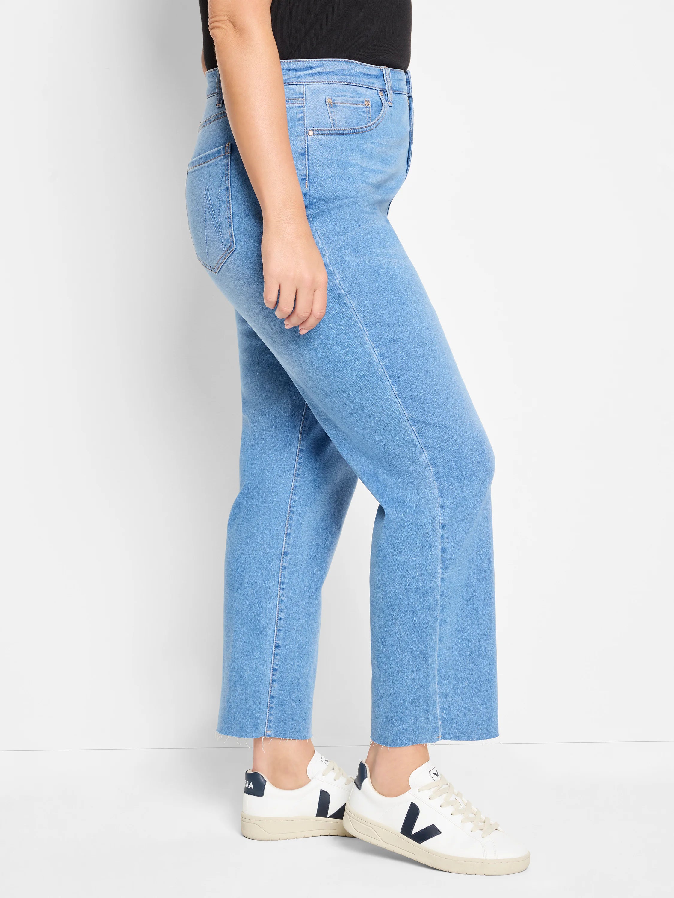 Light blue, straight ankle jeans with a frayed hem.