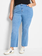 Light blue straight ankle jeans with button fly, front pockets, and raw, frayed ankle hems.