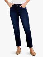 Dark wash straight ankle jeans with frayed hems, shown on a person.