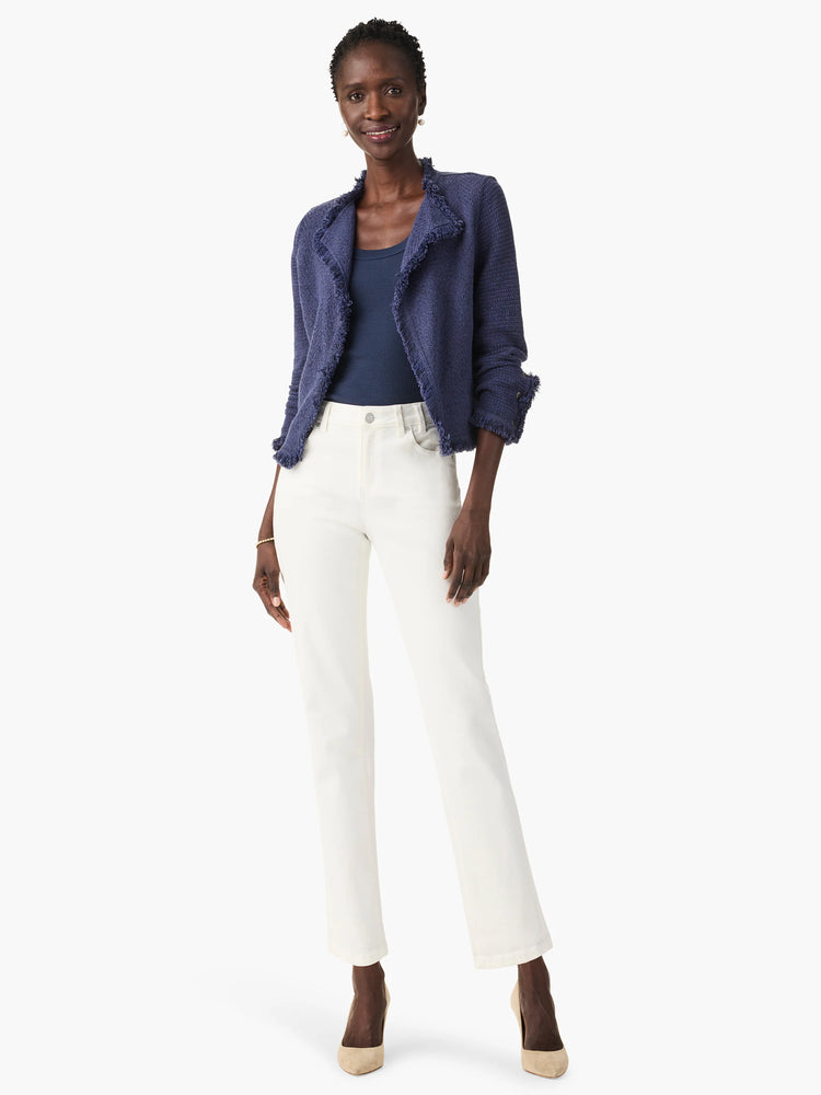 White straight ankle jeans, high-waisted with a clean hem, worn on a model.
