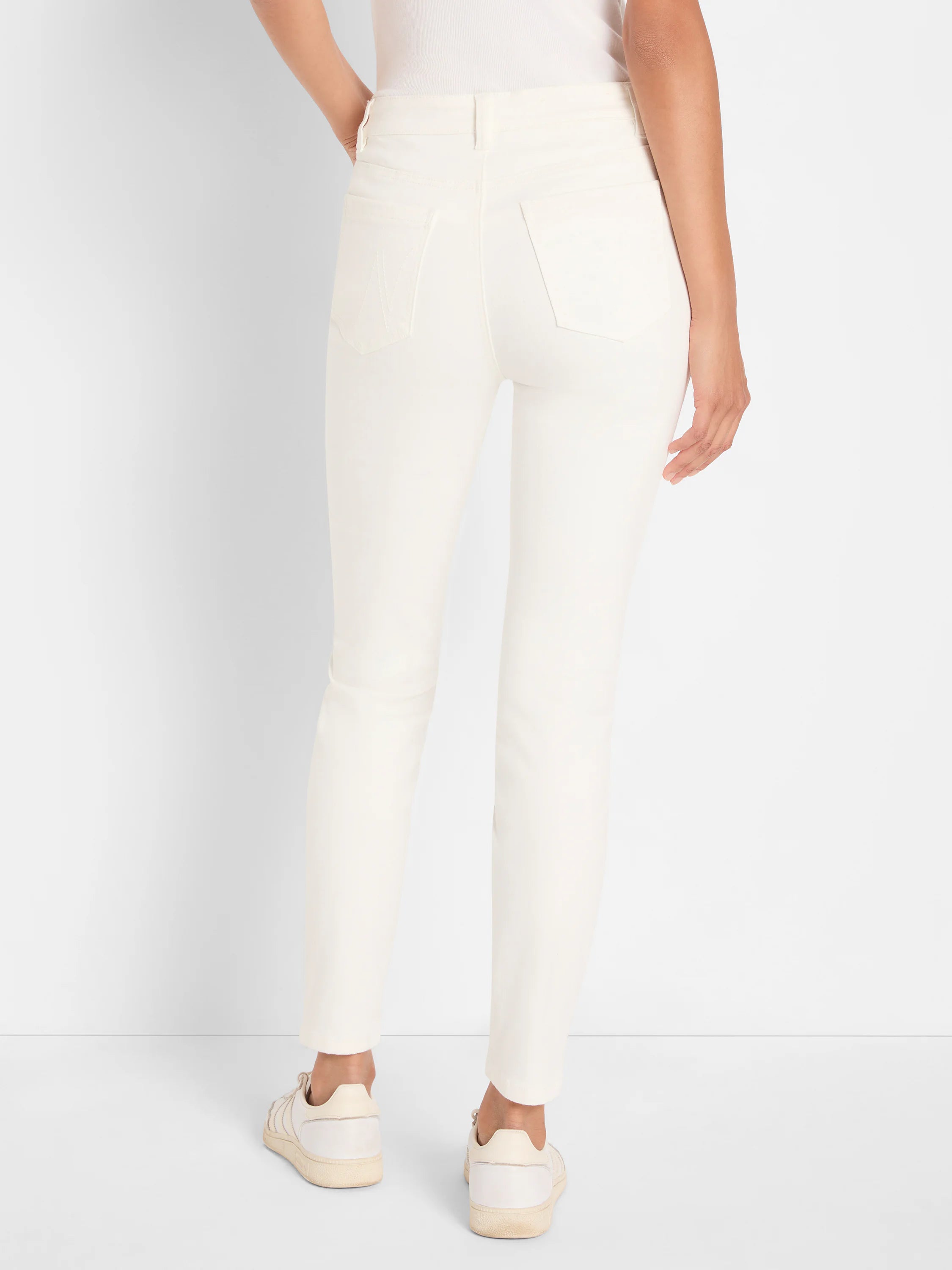 Ecru slim ankle jeans, back view. Features two back patch pockets, one with subtle decorative stitching.