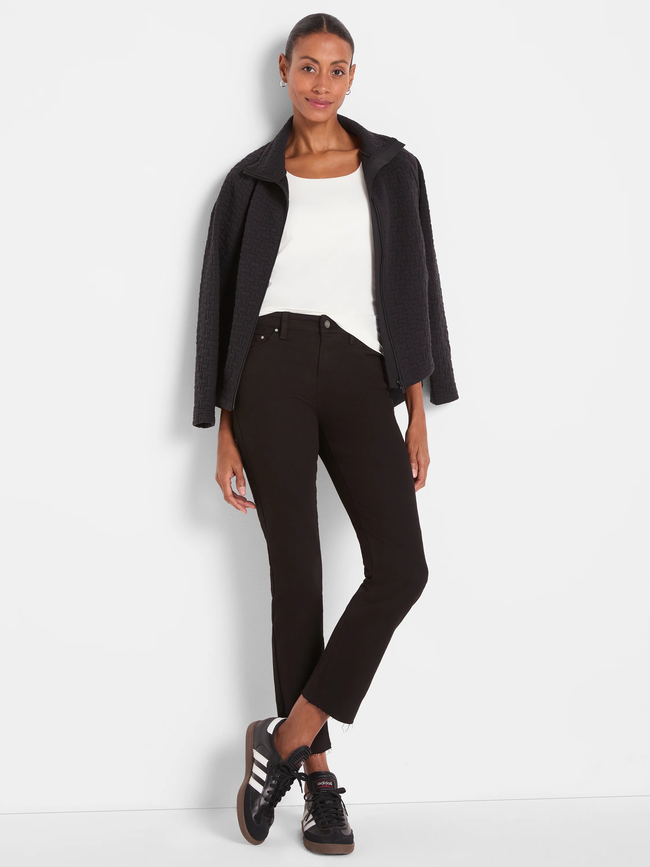 Solid black straight ankle jeans with a frayed hem.