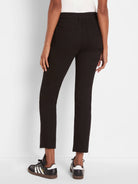 Black straight ankle jeans on a model, shown from behind. Features frayed hems and visible back pockets.