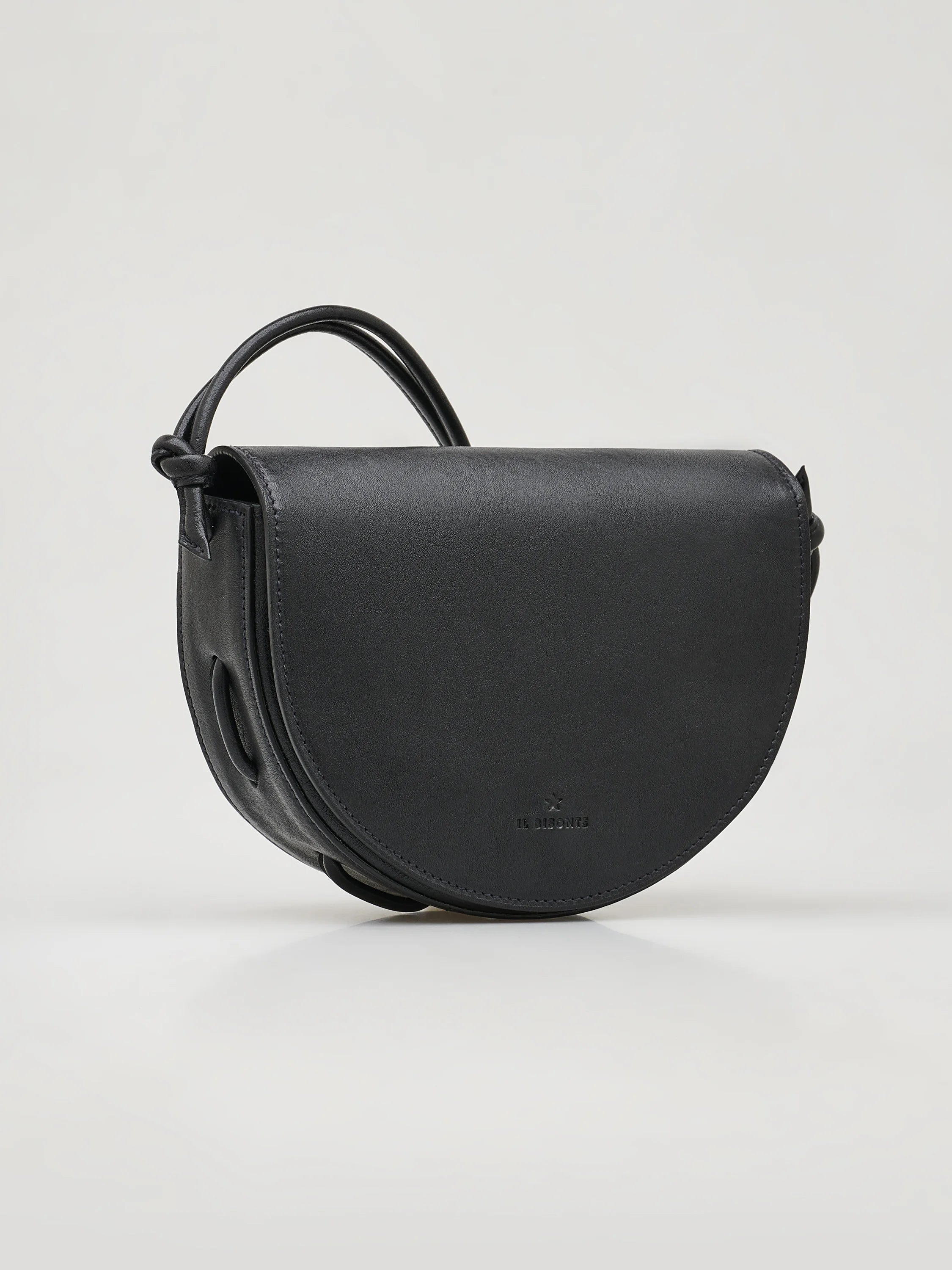 Black half-moon crossbody bag with knotted leather strap. Subtle embossed logo.