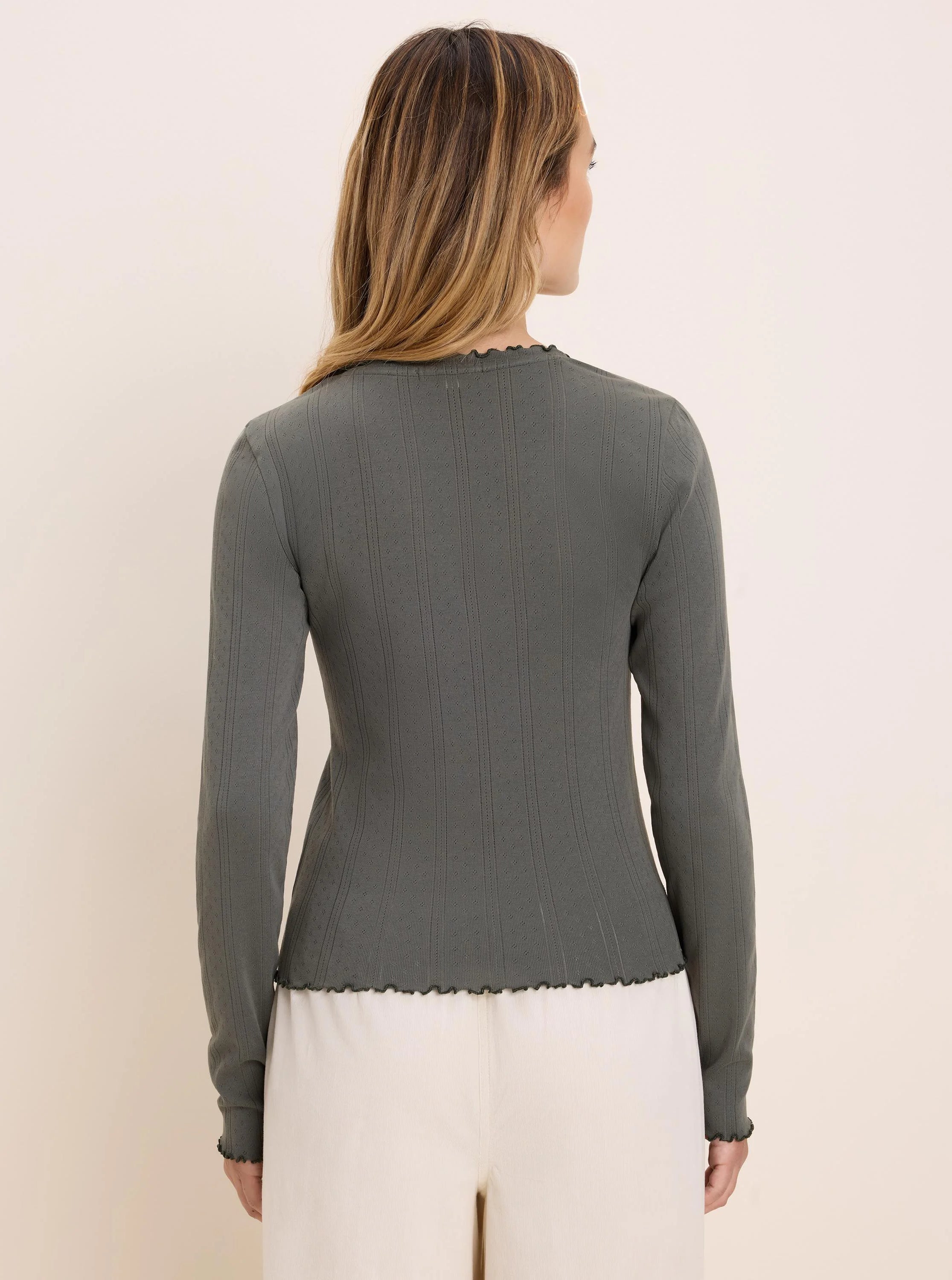 Sage green fitted long sleeve tee with pointelle rib texture and wavy lettuce-edge trim.