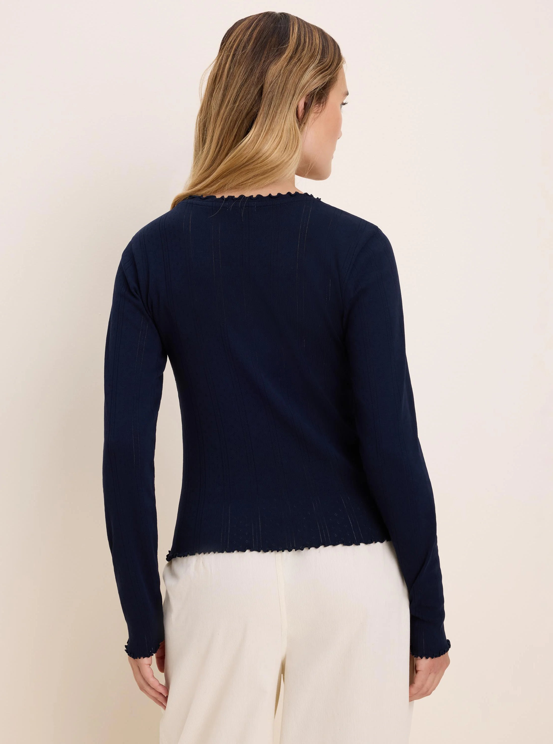 Navy pointelle rib long sleeve tee with scalloped edges at the neckline, cuffs, and hem.