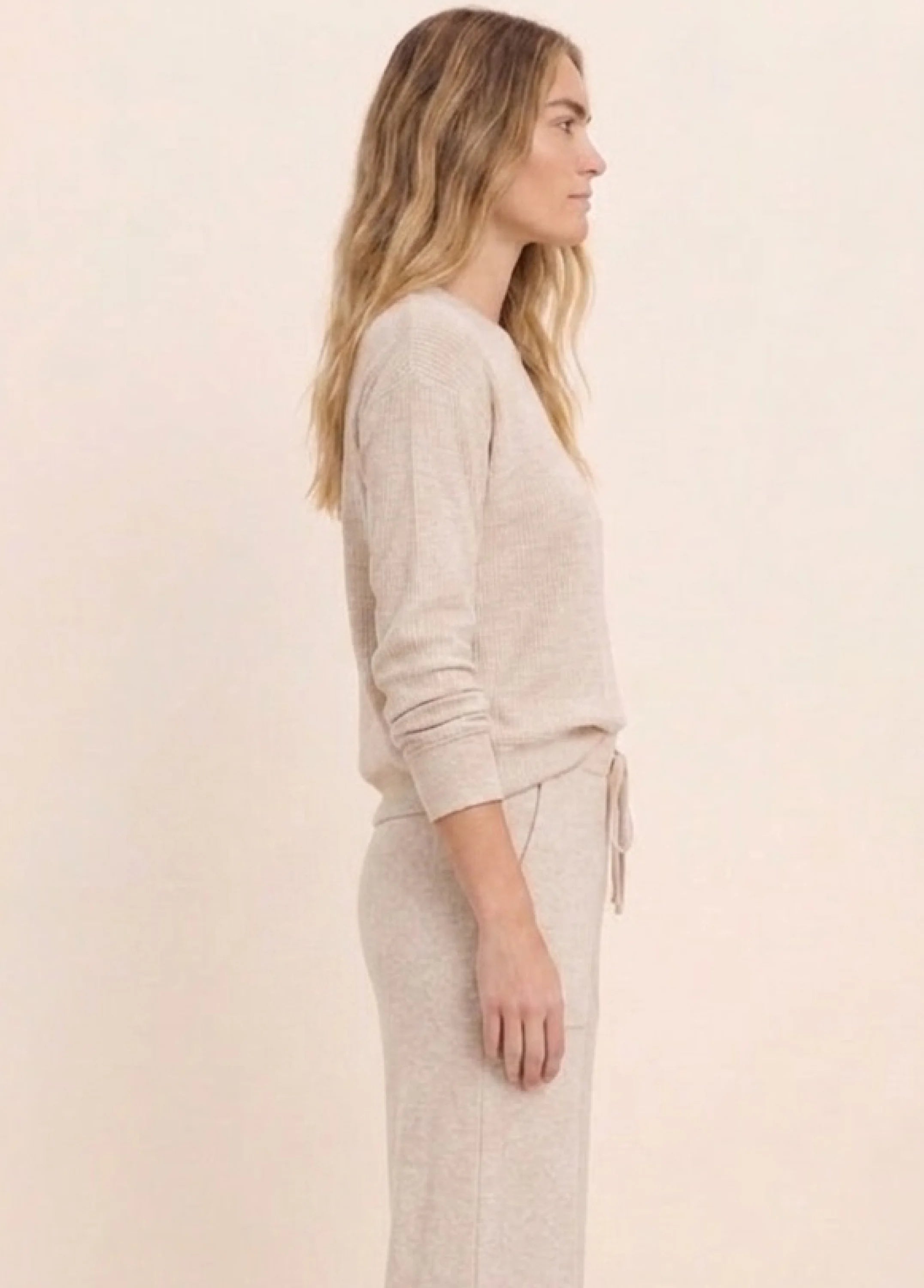 Light beige ribbed cotton terry crew-neck top with long sleeves.