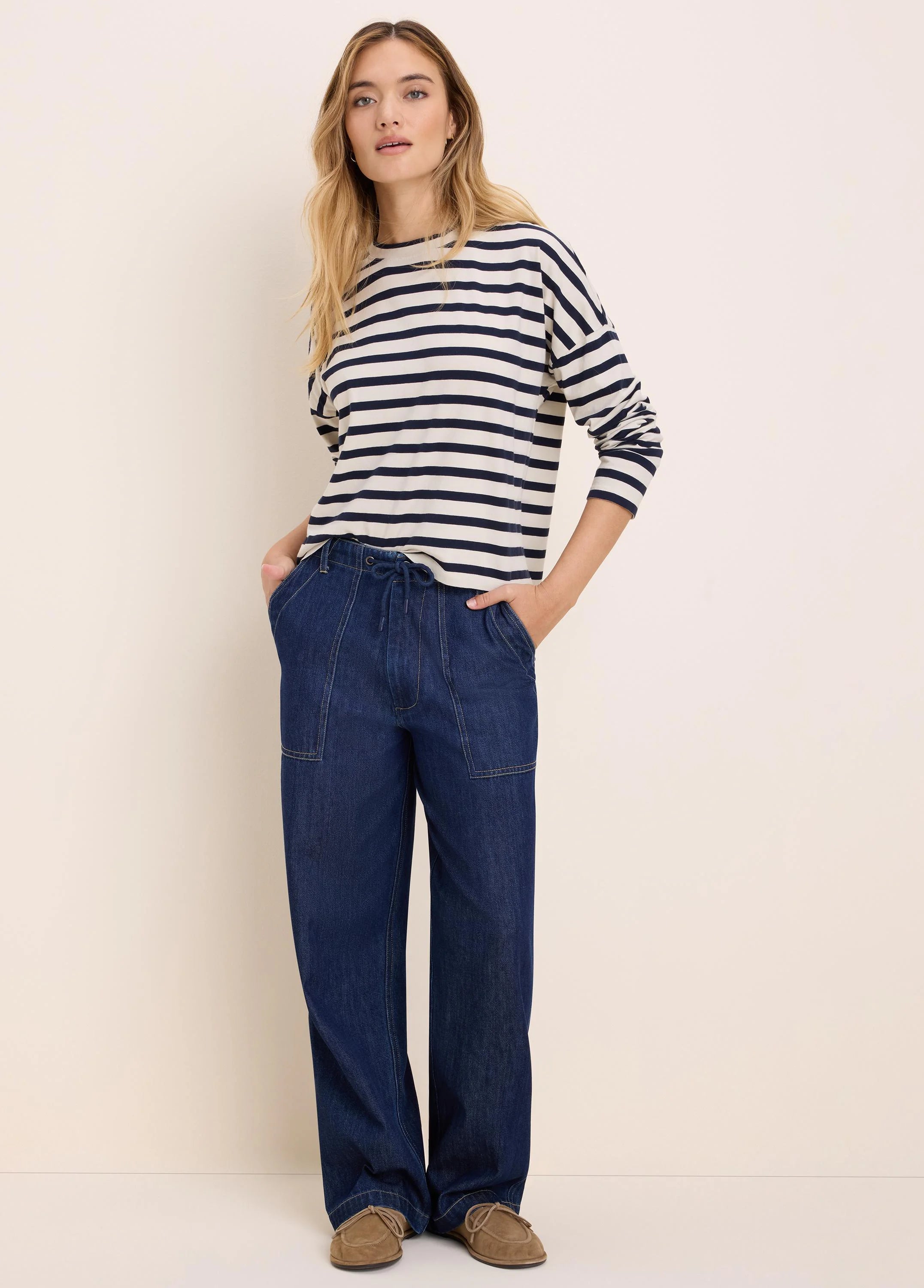Cream and navy horizontally striped long-sleeve tee with a crew neck.