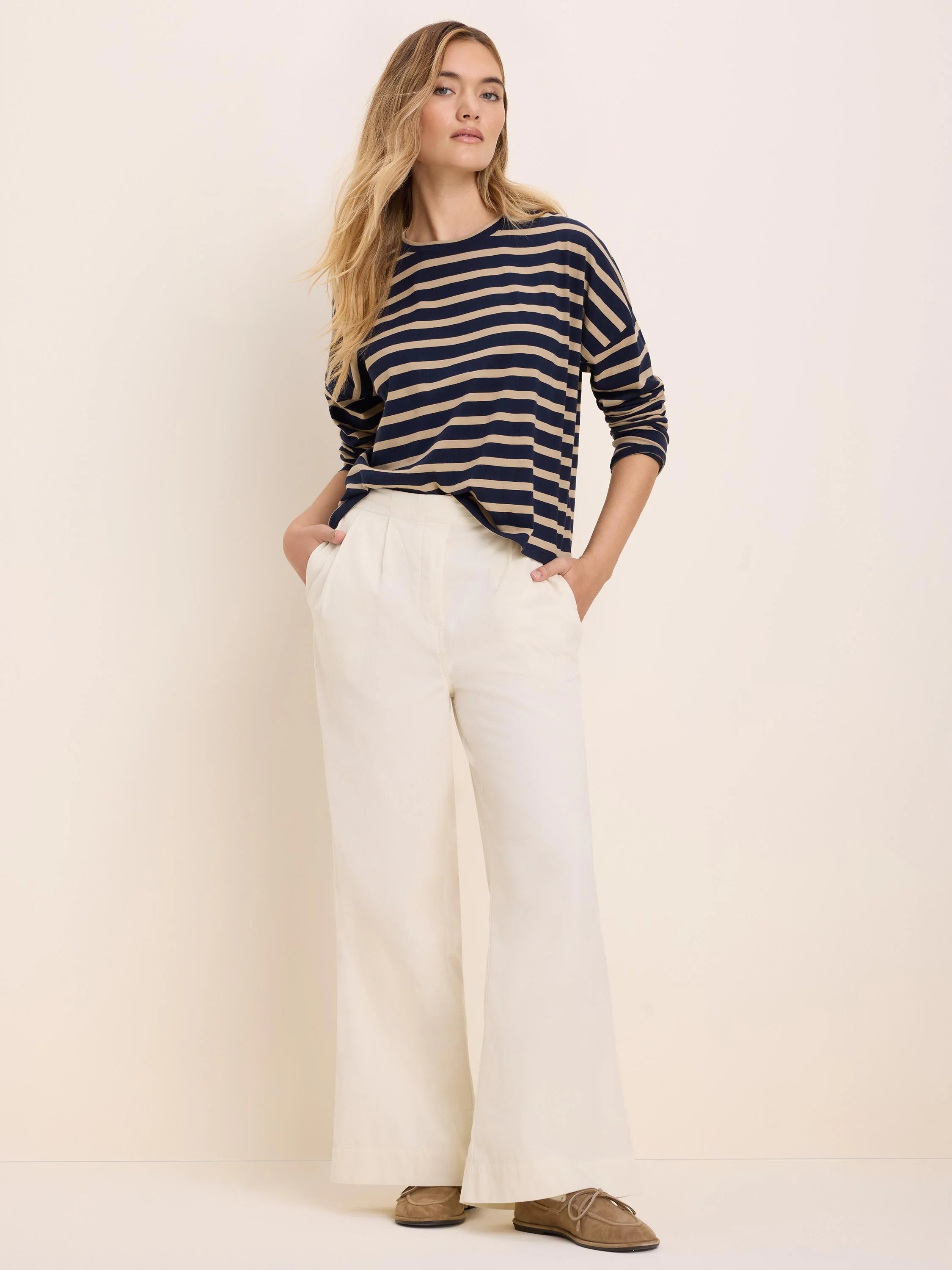 Navy and tan horizontal striped long-sleeve tee.