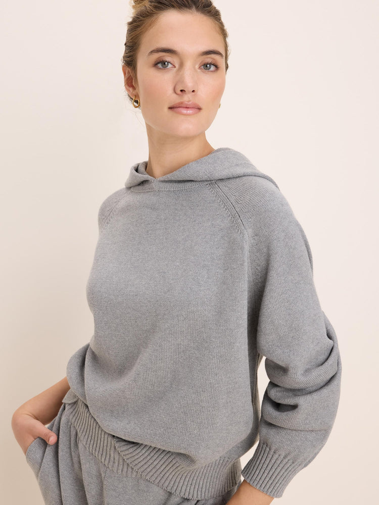 Light grey knitted hoodie with raglan sleeves and ribbed cuffs and hem.