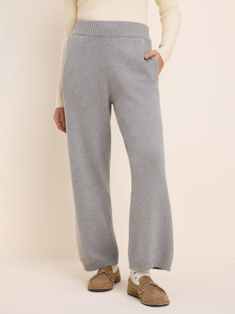 Light grey knit sweater pants with a ribbed waist, side pockets, and wide, relaxed legs.
