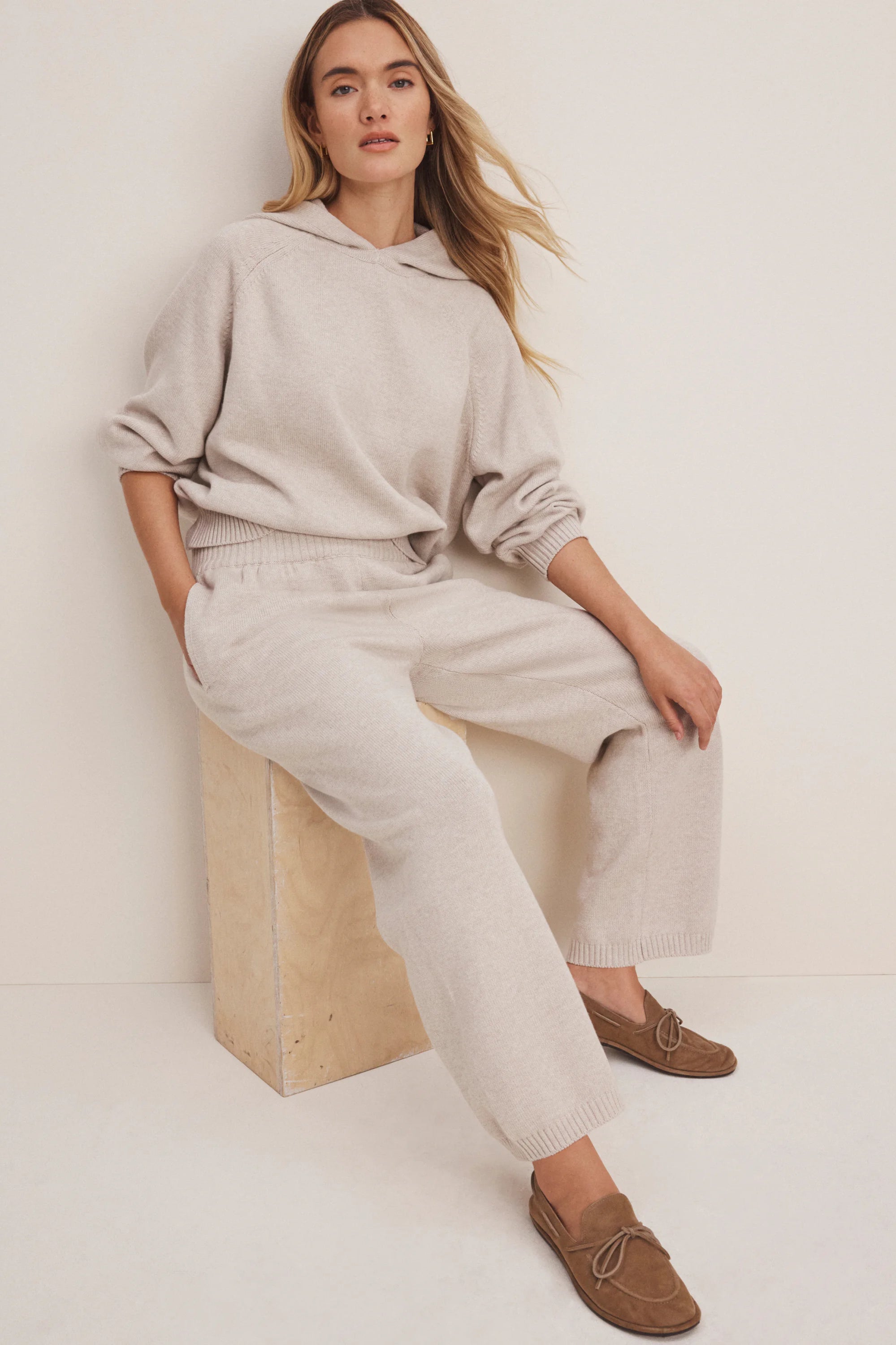 Oatmeal knit wide-leg sweater pants with an elastic waist and ribbed cuffs.