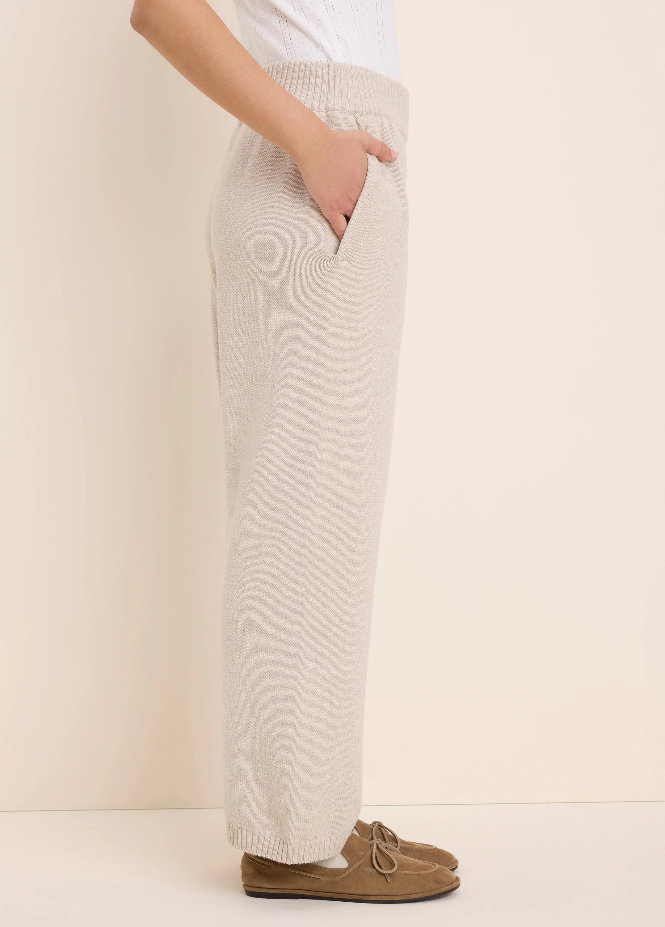 Oatmeal knit wide-leg pants with a ribbed waistband and side pockets.