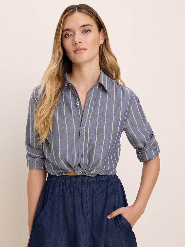 Dobby Stripe Shirt: Blue fabric with pale yellow vertical stripes, rolled sleeves, and a tied front.