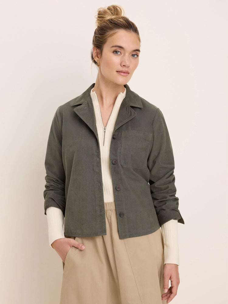 Dark olive green baby cord shirt jacket with a collar, button front, and single chest pocket.