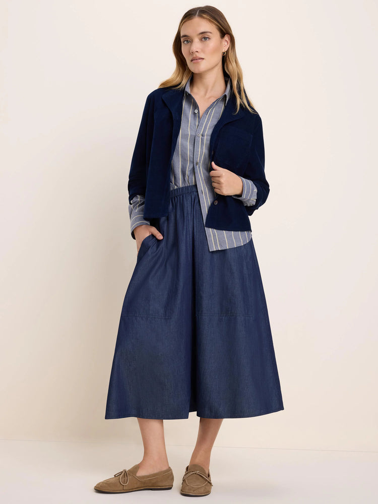 Dark navy baby cord shirt jacket with a fine ribbed texture and a left chest pocket.