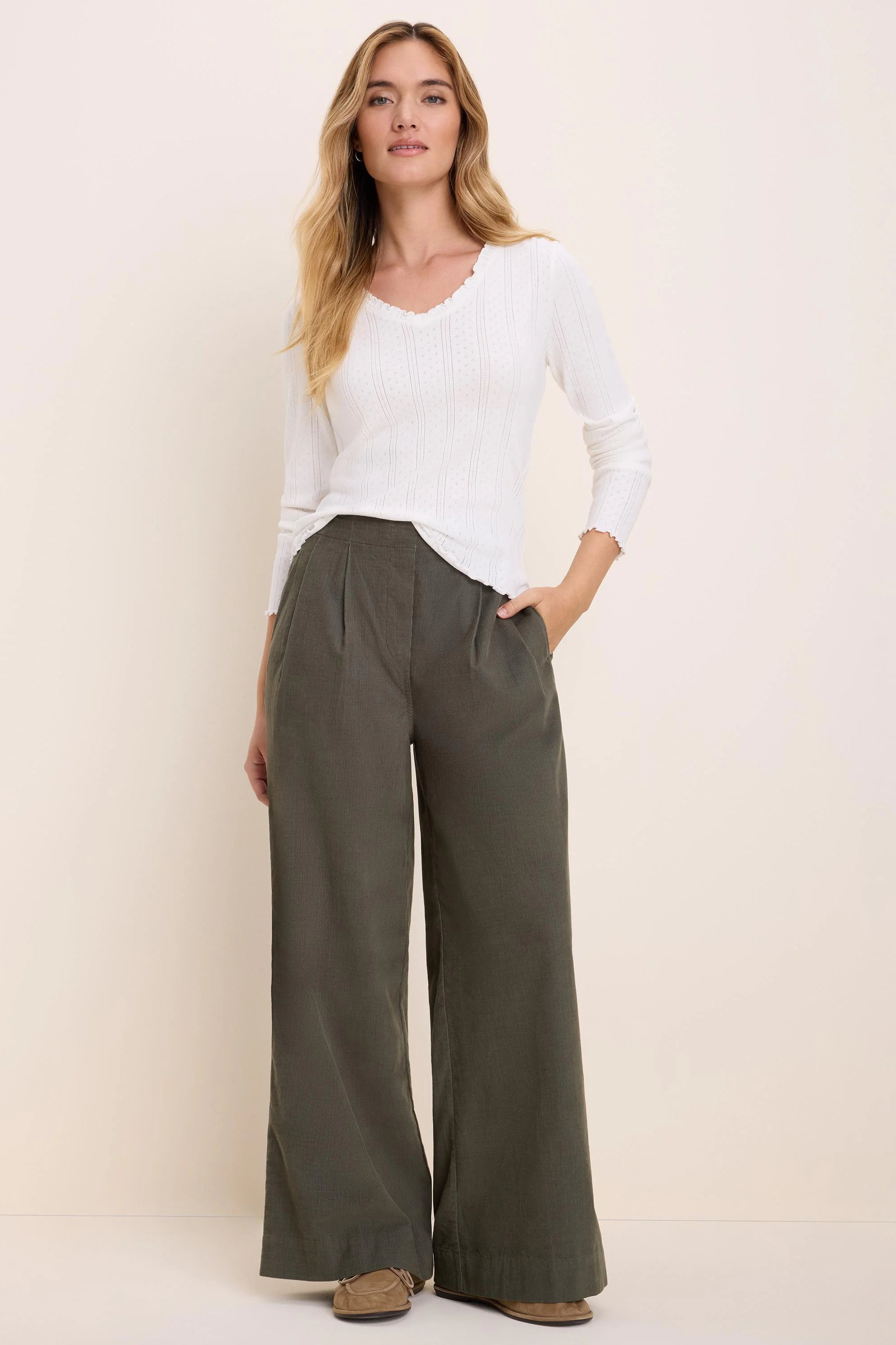Ellis Baby Cord Pant: Dark green wide-leg baby corduroy pants with front pleats.