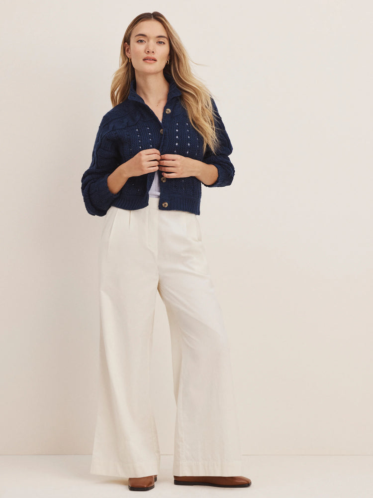 Off-white wide-leg baby cord pants, full-length on a standing model.
