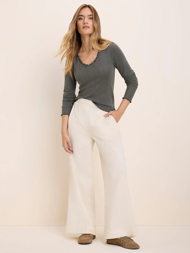 Ellis Baby Cord Pant: Off-white, wide-leg corduroy pants with a fine vertical texture and waist pleats.