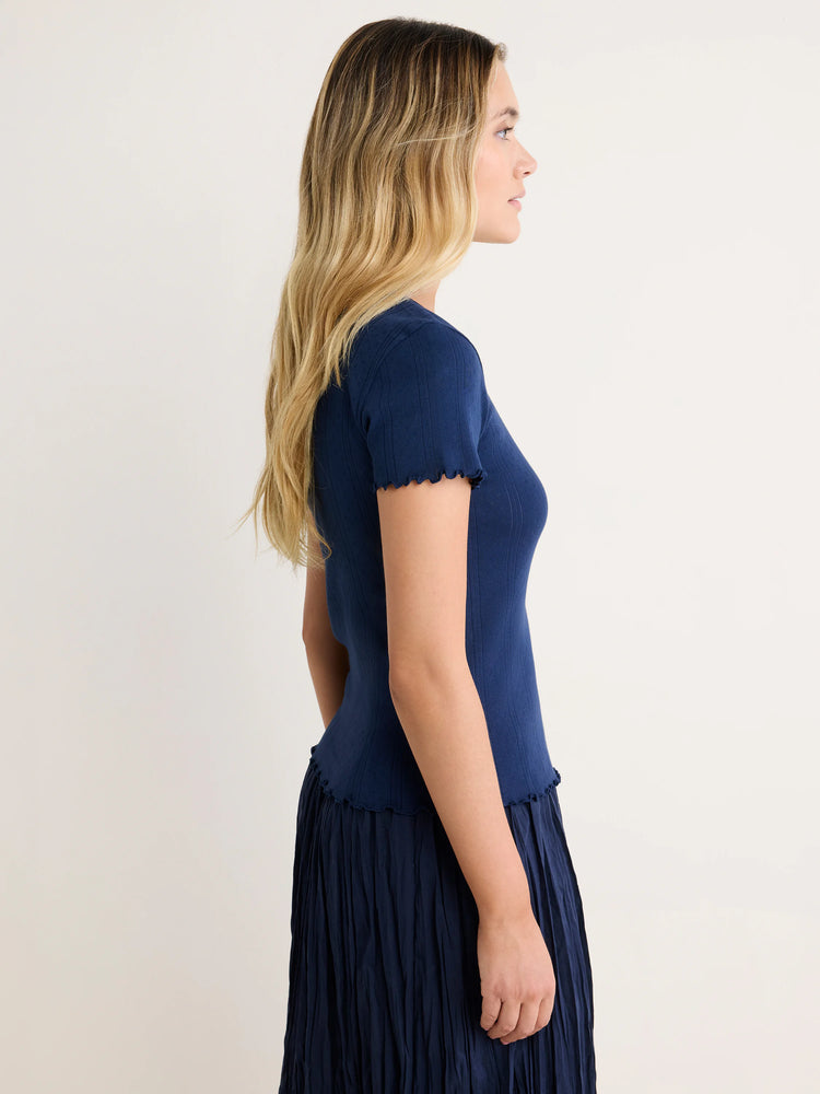 Navy blue pointelle rib tee with short, lettuce-edge sleeves and hem.