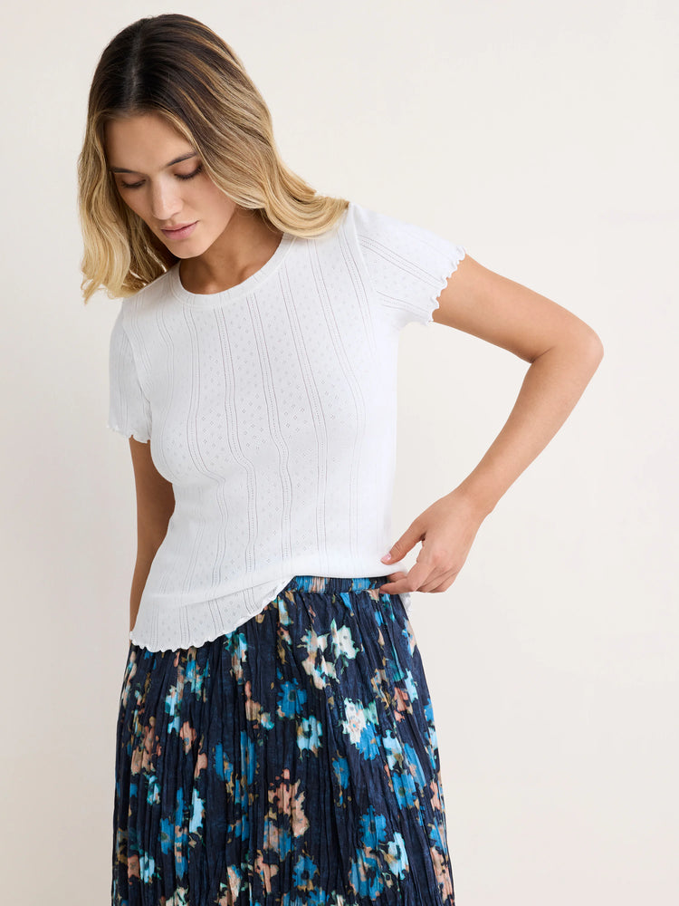 White pointelle rib t-shirt with short, scalloped sleeves and hem.