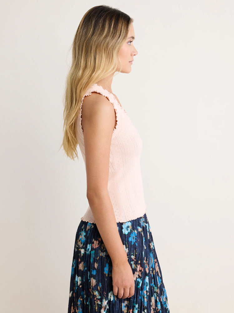 Pale pink pointelle ribbed tank with scalloped neckline, armholes, and hem.