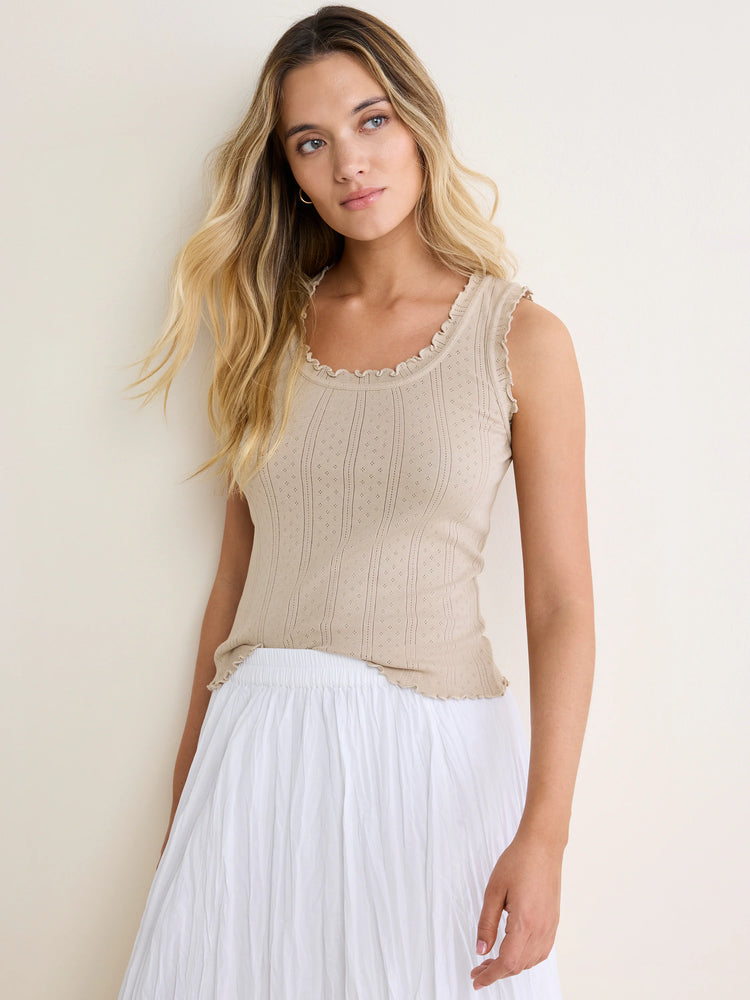 Light beige pointelle rib tank with ruffled neckline, armholes, and hem.