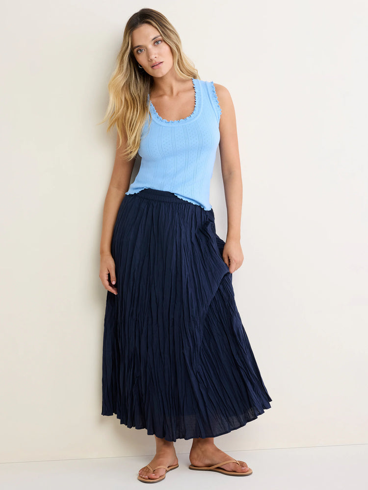 Light blue pointelle rib tank top with ruffled neckline and armholes.
