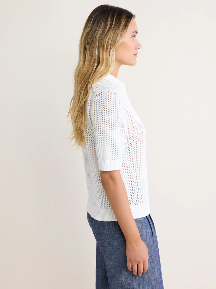 White mesh polo sweater with a collar, short sleeves, and ribbed cuffs and hem. The knit is open and slightly sheer.