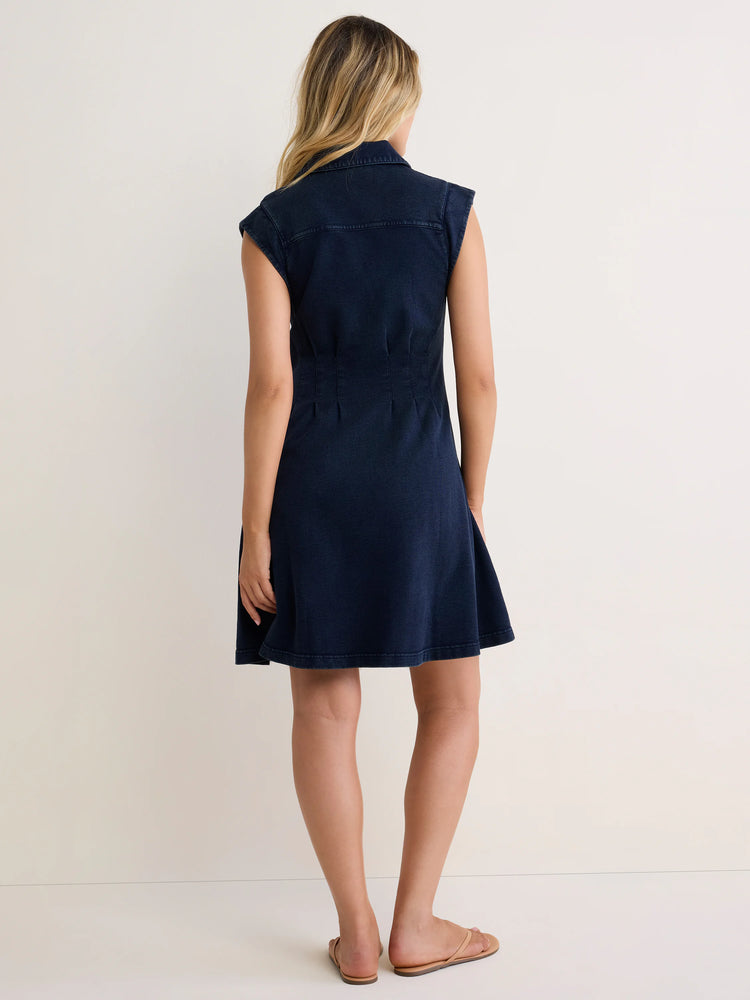 Dark blue sleeveless collared dress, fitted waist with back pleats, and a flared above-knee skirt.