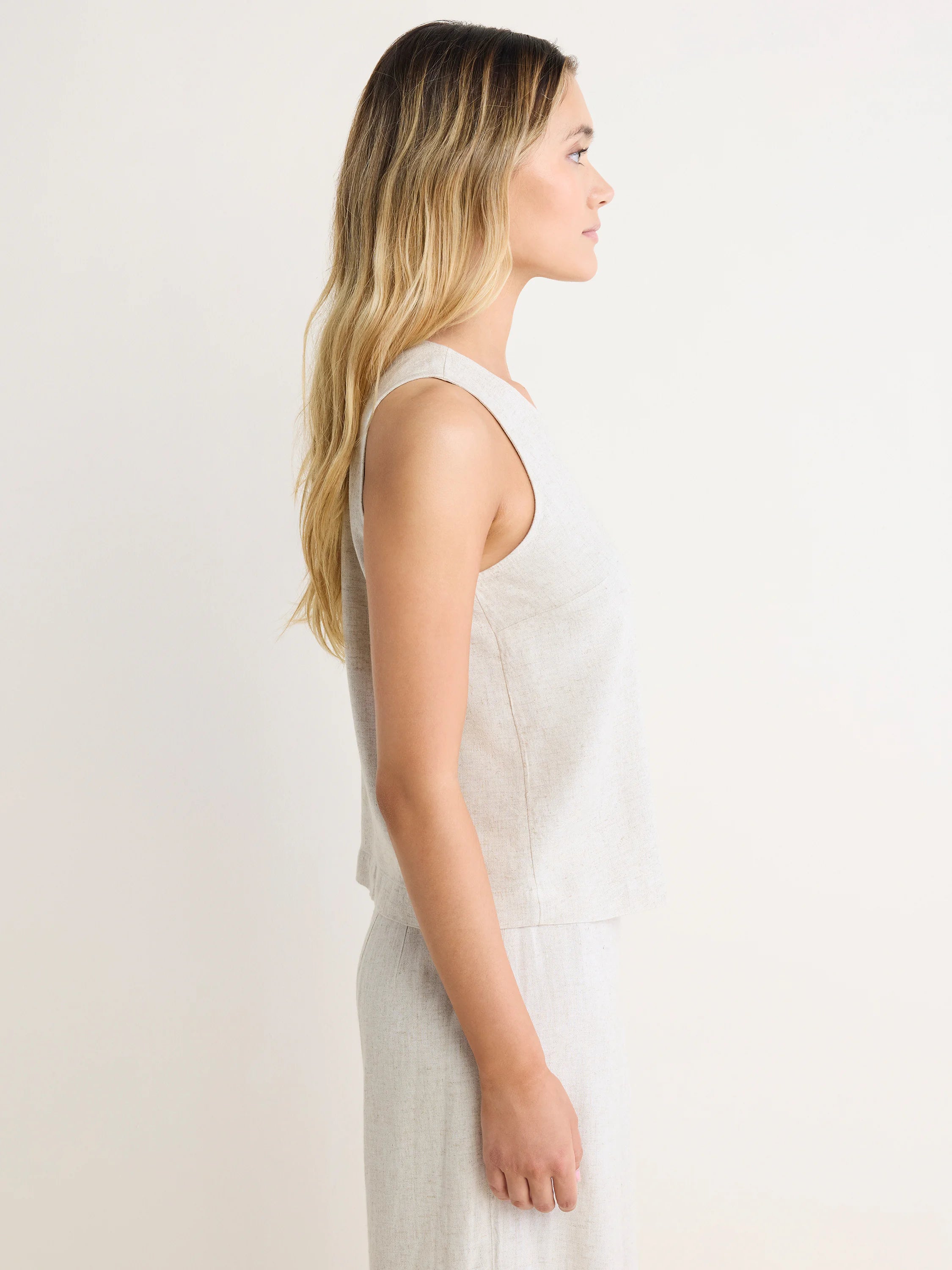 Light beige Stevie Tank: sleeveless, high neck, with a visible linen texture.