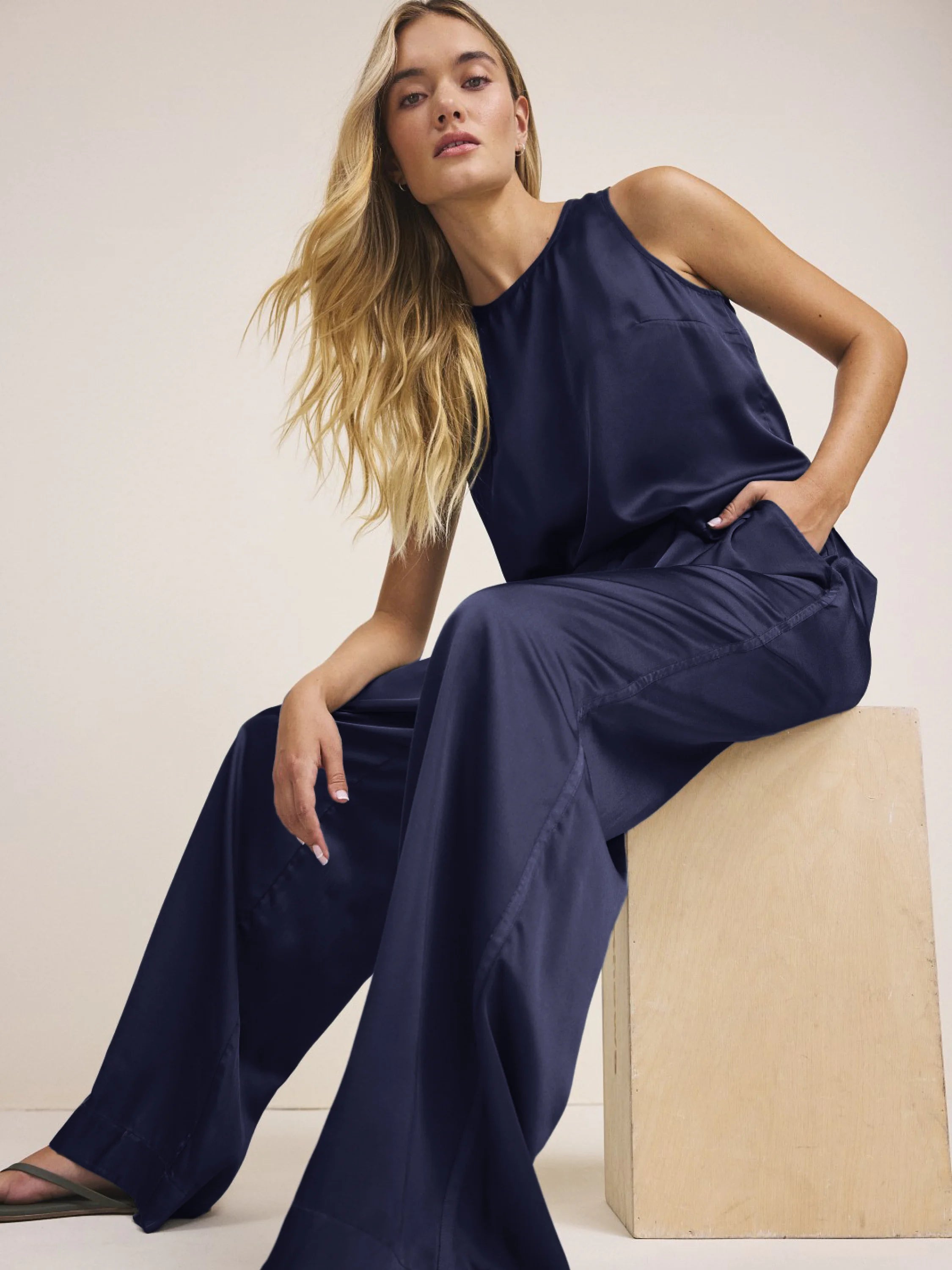 Navy blue relaxed fit sleeveless tank with a high neck.