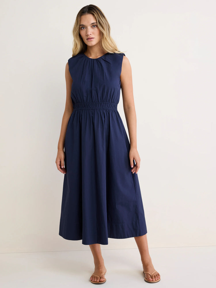 Navy sleeveless dress with gathered round neck, elasticized waist, and A-line midi skirt.